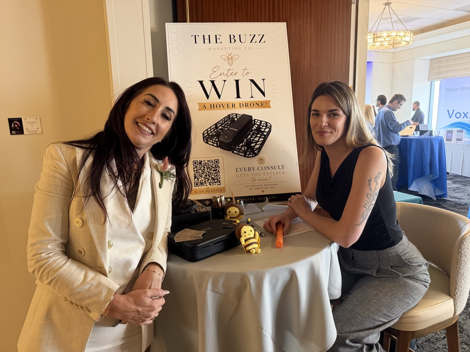 Buzz Marketing team members meeting attendees at an event